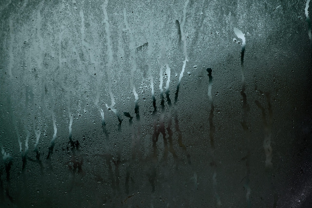 Heavy condensation running down a window — usually a ducting problem, not the fan